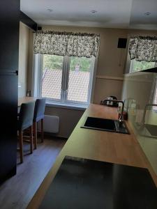 a kitchen with a large window and a kitchen counter at Apartment in Rjukan in Rjukan