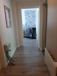 a hallway with a room with a brick wall at Apartment in Rjukan in Rjukan