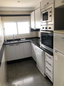 Kuchyň nebo kuchyňský kout v ubytování Terraza Albir