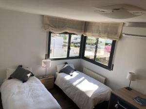 Posteľ alebo postele v izbe v ubytovaní R64 Deluxe Villa Déjà Vu