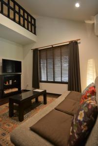 a living room with a couch and a table at Hakone Mori No Yado in Hakone