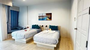 מיטה או מיטות בחדר ב-AURIFLEX HOUSE