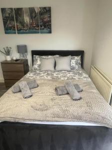 a bed with two pillows on top of it at Abington Park 5 Bedrooms with en-suite in Spinney Hill