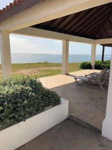 a pavilion with a view of the ocean at Beach access apartment in Portmore