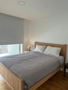 Ένα ή περισσότερα κρεβάτια σε δωμάτιο στο Porto Artemis flat