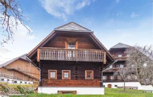 a wooden house with a gambrel roof at Amazing Home In Fischbach With 2 Bedrooms And Wifi in Fischbach
