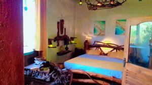a bedroom with a large bed and a window at SD3M ART GALLERY Villa in Dickwella
