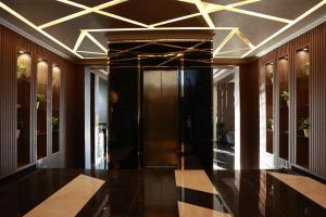 a hallway with a elevator in a building at DAMIR HOTEL in Nukus