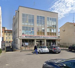 a man walking in front of a building at MILANFORESTER in Milan