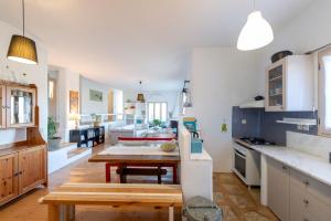 a kitchen with a table and a dining room at Eklekti House in Firókambos