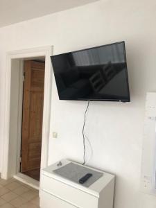 a flat screen tv hanging on a wall at Haus zur Eiche 1 in Dahme