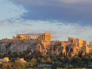 a view of the acropolis of athens from atop a mountain at COMBO Acropolis view 6 bedrooms 4 bathrooms in Athens