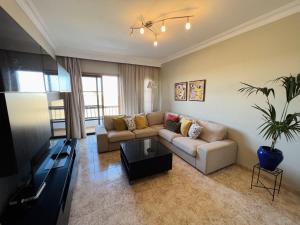 a living room with a couch and a tv at Casa Cielo in Arrecife