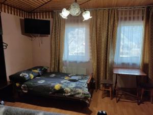 Postel nebo postele na pokoji v ubytování V Ulyanu