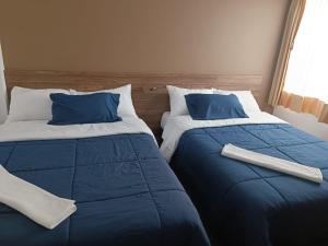 two beds sitting next to each other in a bedroom at LA CASA DE MATHIAS 'Samcal' in Baños +27 photos