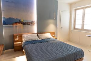 Postel nebo postele na pokoji v ubytování CASA LORENZO