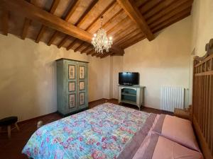 A bed or beds in a room at Villa San Bartolomeo