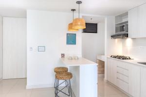 Virtuvė arba virtuvėlė apgyvendinimo įstaigoje Origen Local Suites