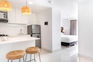 Virtuvė arba virtuvėlė apgyvendinimo įstaigoje Origen Local Suites