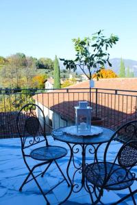 a table and chairs on a patio with a view at HEATHER'S HOME 108 - Appartamento vista mozzafiato in Bassano del Grappa