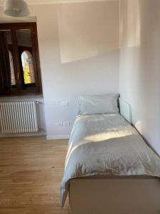 Postel nebo postele na pokoji v ubytování Residenza Le Fornaci