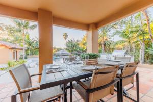 a dining room with a table and chairs on a patio at ENC-1408 - Enchanting Encinitas Retreat in Encinitas