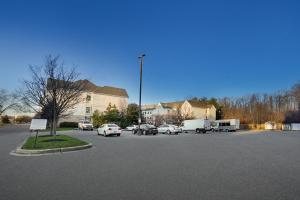 a parking lot with cars parked in front of a building at Staybridge Suites Columbia - Baltimore, an IHG Hotel in Columbia