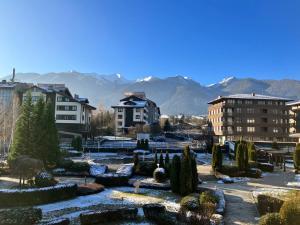 a city with a garden with trees and buildings at PARADISE RELAX APARTMENT in Bansko