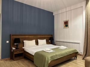 Voodi või voodid majutusasutuse Hotel King Tom toas