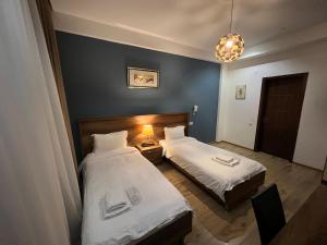 Voodi või voodid majutusasutuse Hotel King Tom toas