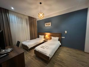 Voodi või voodid majutusasutuse Hotel King Tom toas