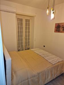 Postel nebo postele na pokoji v ubytování Marcella va a Civita