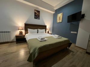 Voodi või voodid majutusasutuse Hotel King Tom toas