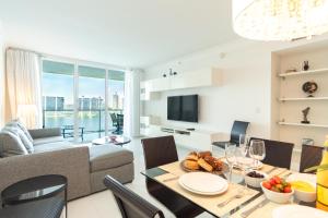 a living room with a couch and a table at Marina Bay 113 in Miami Beach
