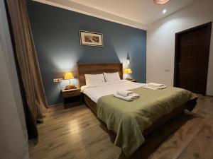 Voodi või voodid majutusasutuse Hotel King Tom toas