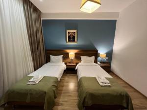 Voodi või voodid majutusasutuse Hotel King Tom toas