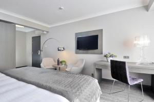 Postel nebo postele na pokoji v ubytování Hotel Agenda Louise