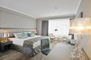 Postel nebo postele na pokoji v ubytování Hotel Agenda Louise