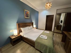 Voodi või voodid majutusasutuse Hotel King Tom toas