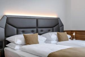 Vuode tai vuoteita majoituspaikassa IMLAUER Hotel Nestroy Wien