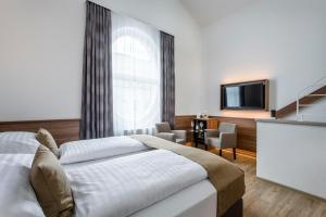 Vuode tai vuoteita majoituspaikassa IMLAUER Hotel Nestroy Wien