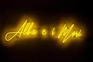 a neon sign that says al salsa llorogi at Alba e i Mori in Palermo