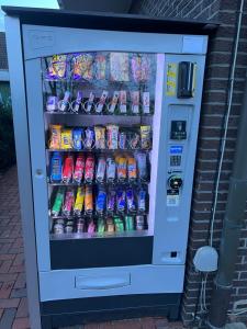 a vending machine filled with drinks and soda at Pension Haus Erika in Lingen