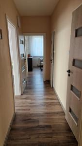 an empty hallway with a door and a room at Byt s jedinečným výhledem in Děčín