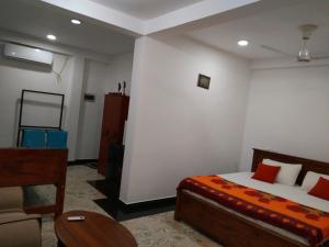 Ένα ή περισσότερα κρεβάτια σε δωμάτιο στο Villa Sidu