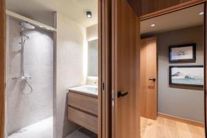 a bathroom with a shower and a sink at W ISARD LODGE by Select Rentals in El Tarter