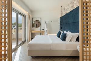 Postel nebo postele na pokoji v ubytování White Nest Villas + 22 fotografií
