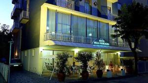 a large building with plants in front of it at Hotel Bella Romagna in Rimini