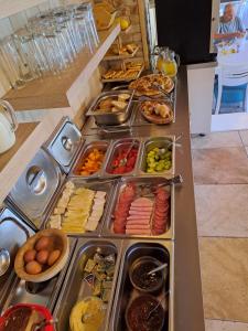 a buffet line with many different types of food at Rooms and apartmants Mirovic in Kolašin