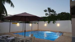 Der Swimmingpool an oder in der Nähe von Villa Sol Taino, Hotel en Boca chica, 5 minutos del Aeropuerto Internacional las Américas